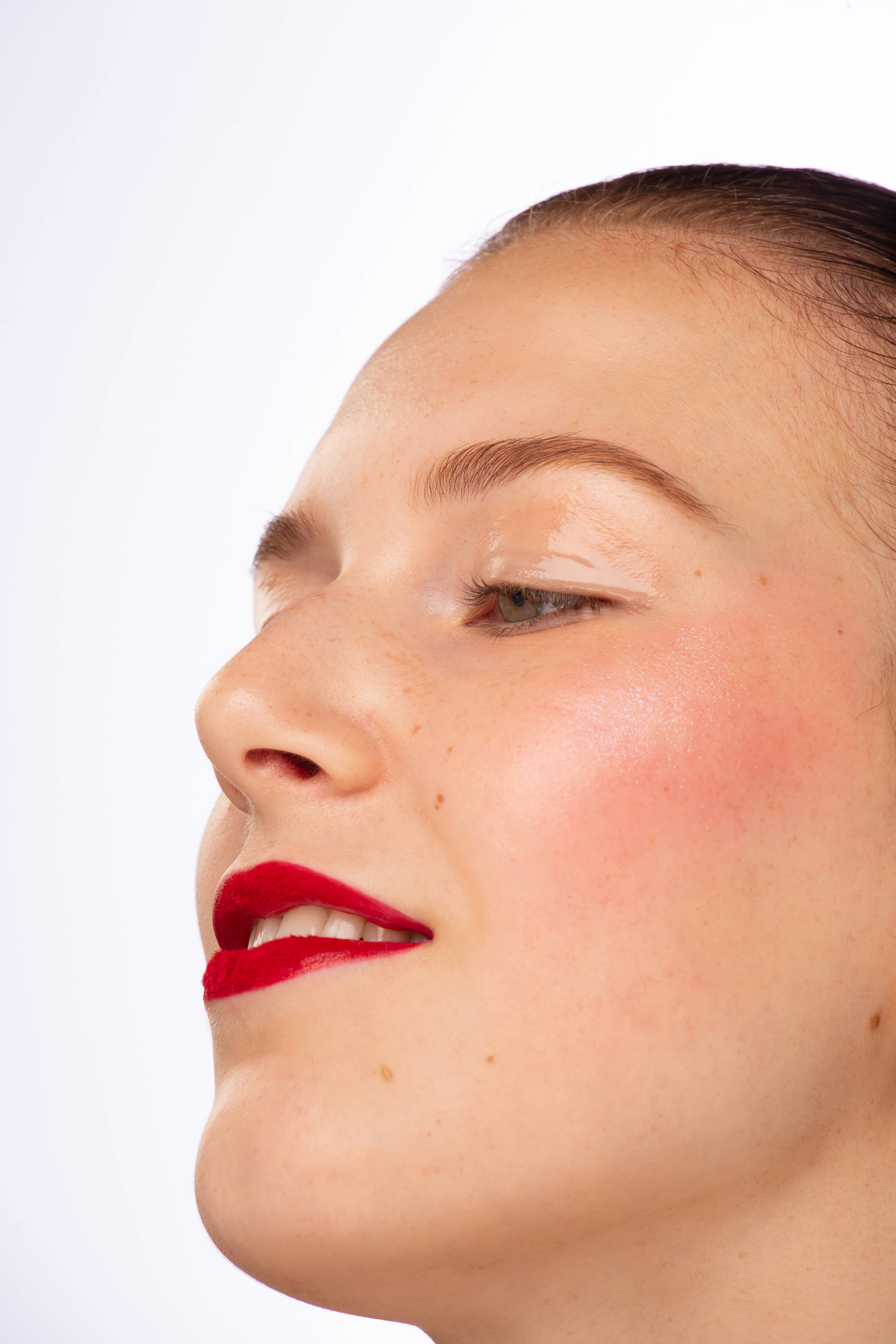 Woman with red lipstick, side-view