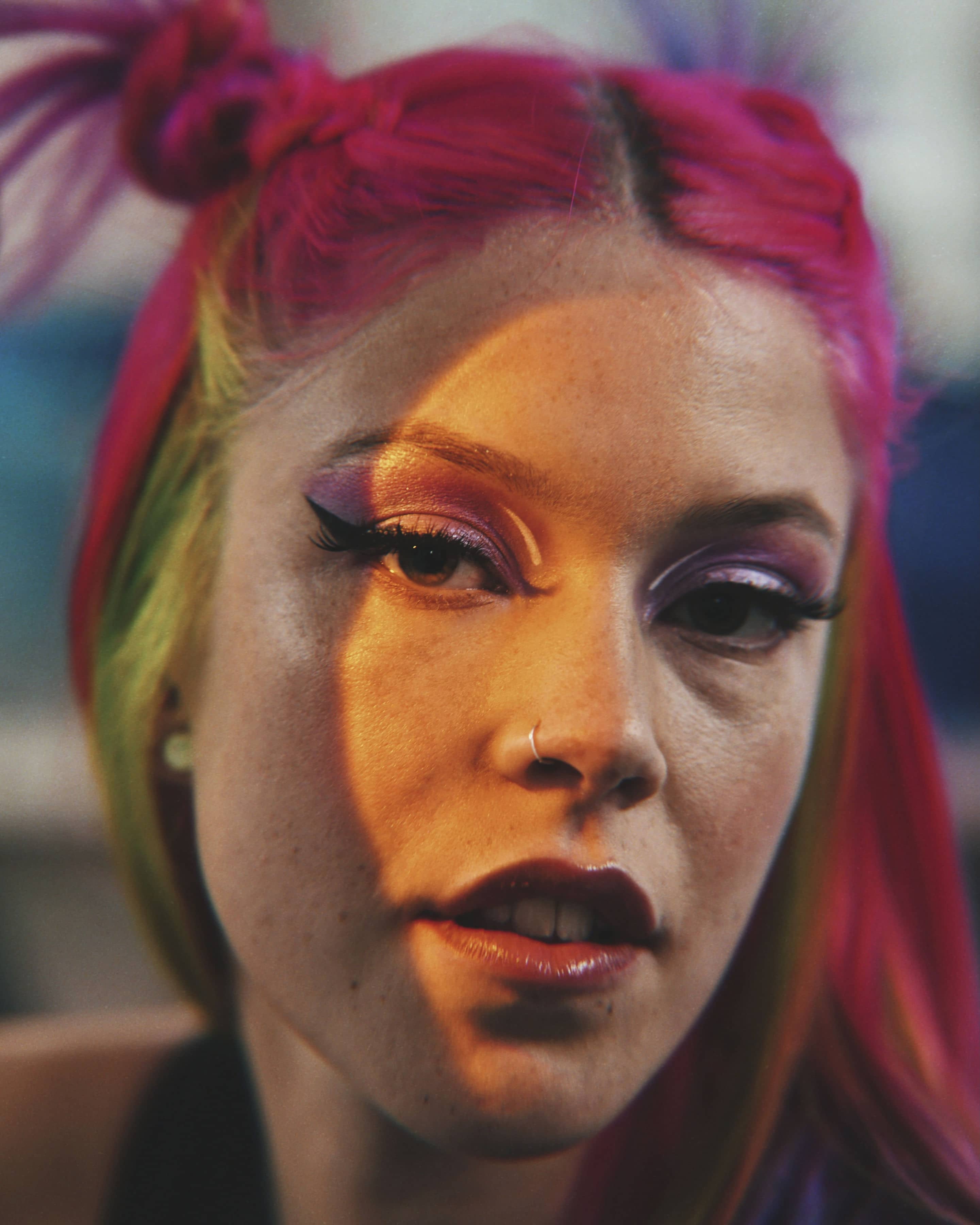 Woman with colorful hair and makeup, closeup
