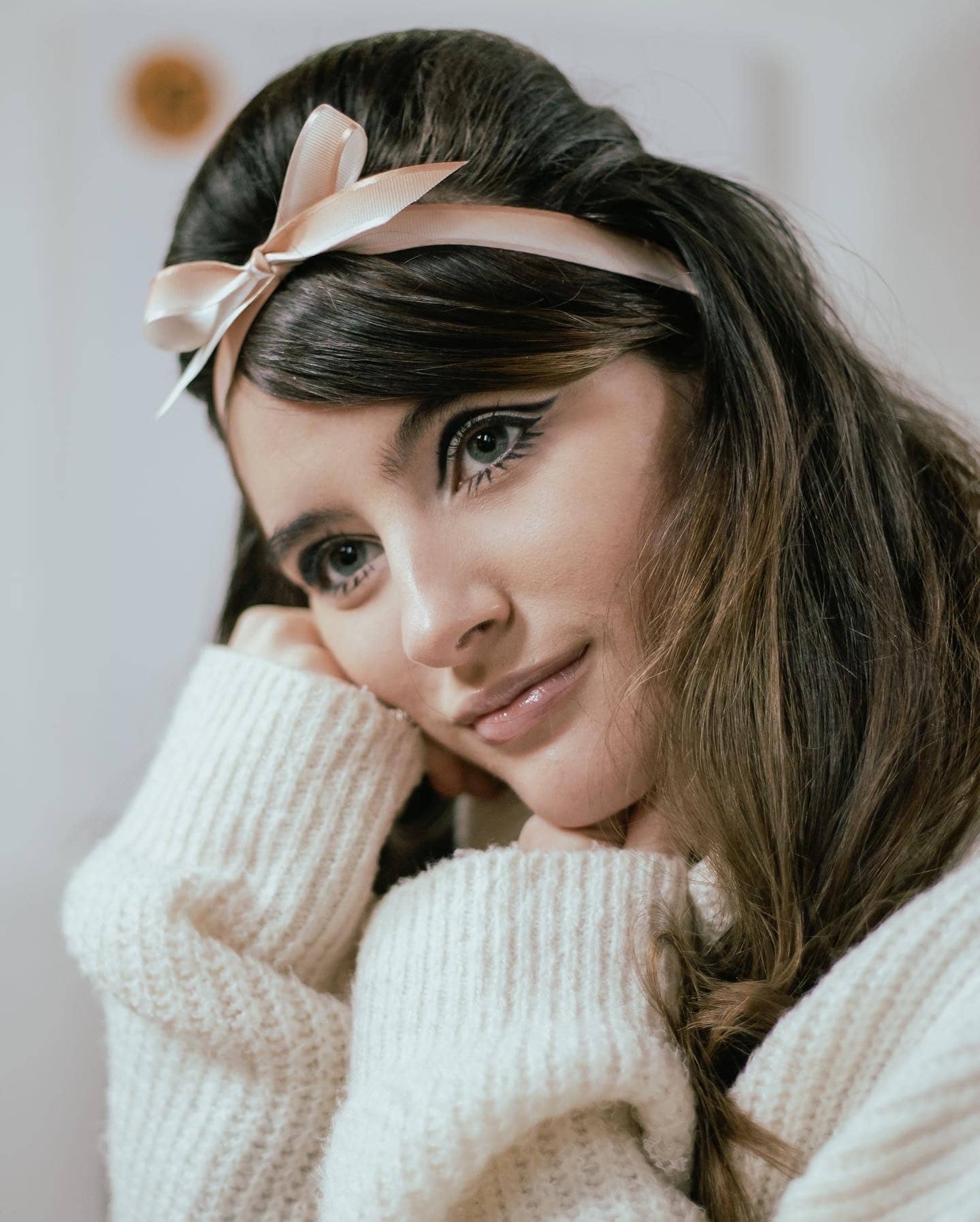 Woman with pink bow, closeup