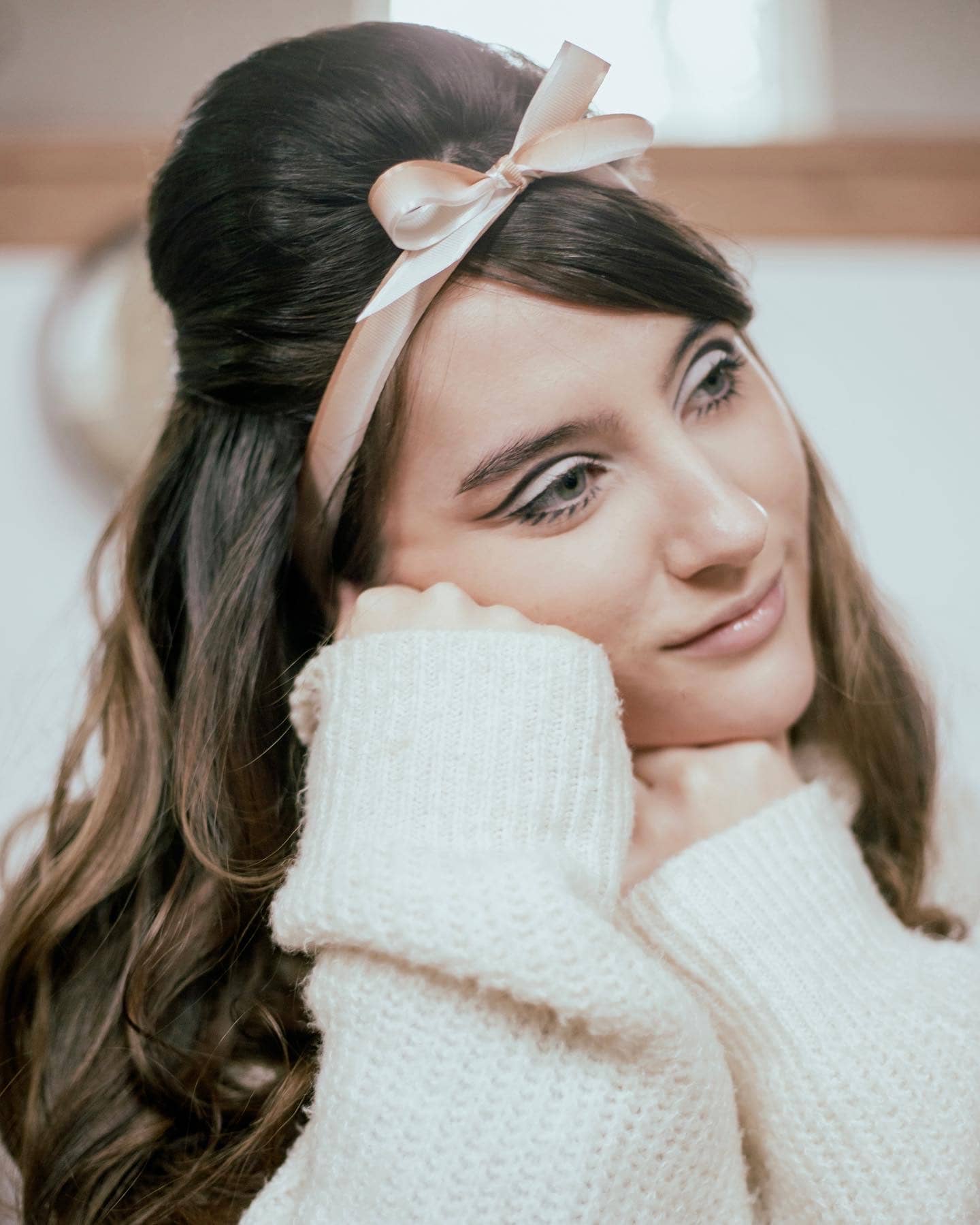 Woman with pink bow, closeup