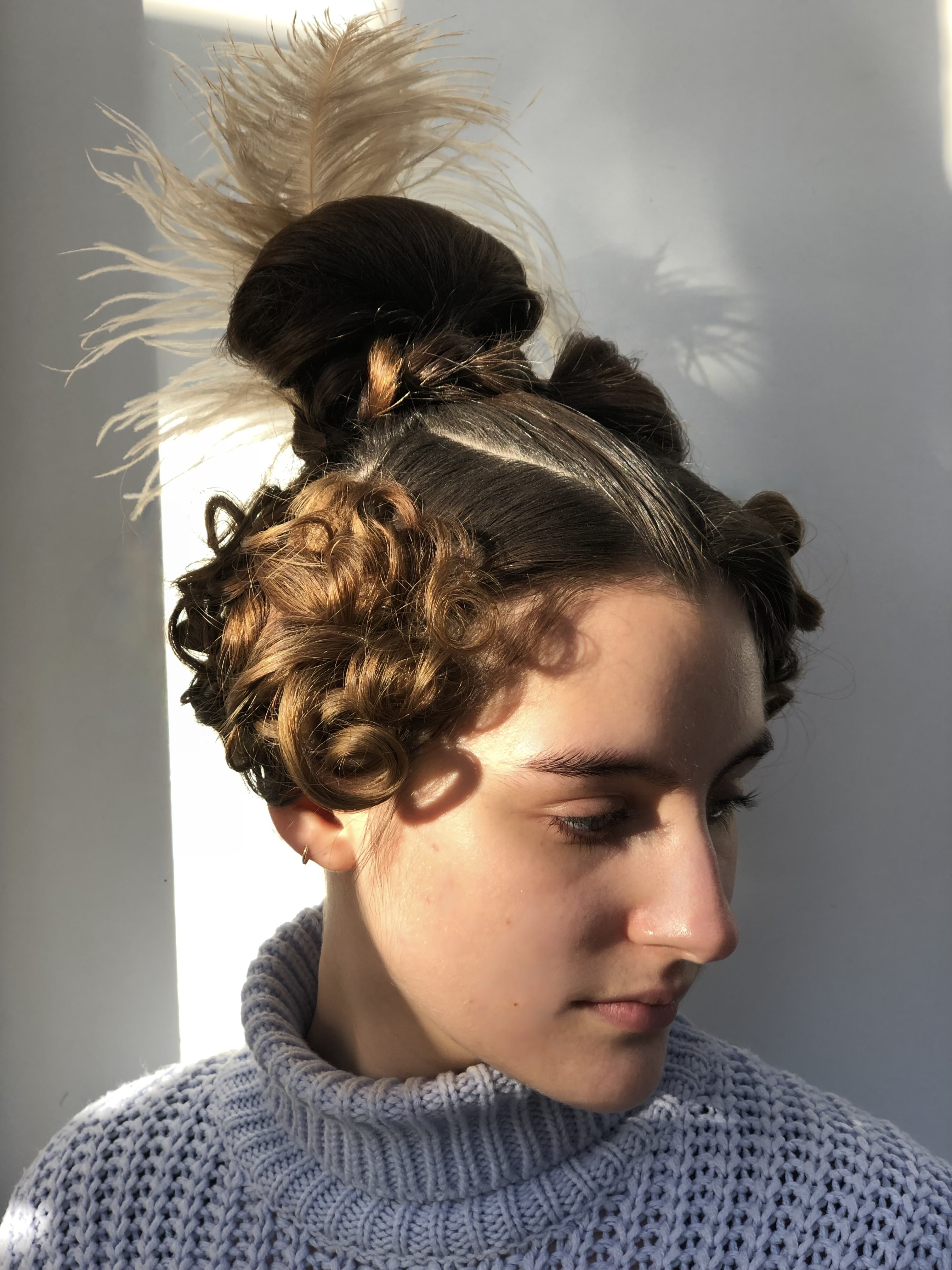 Curly brown hair elegantly tied up
