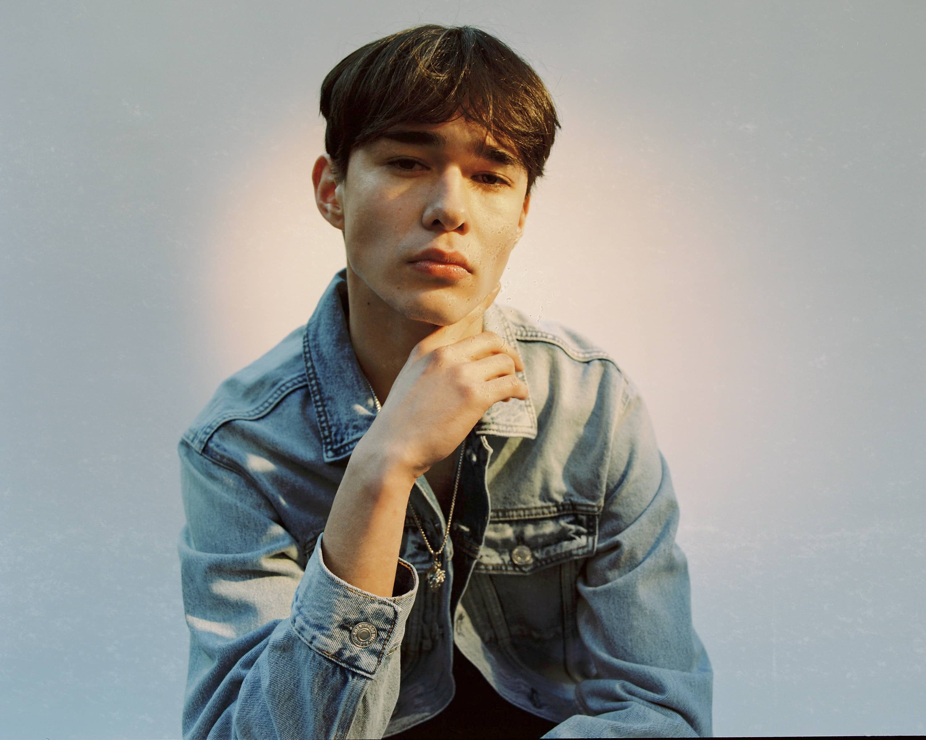 Man in denim with short hair, closeup