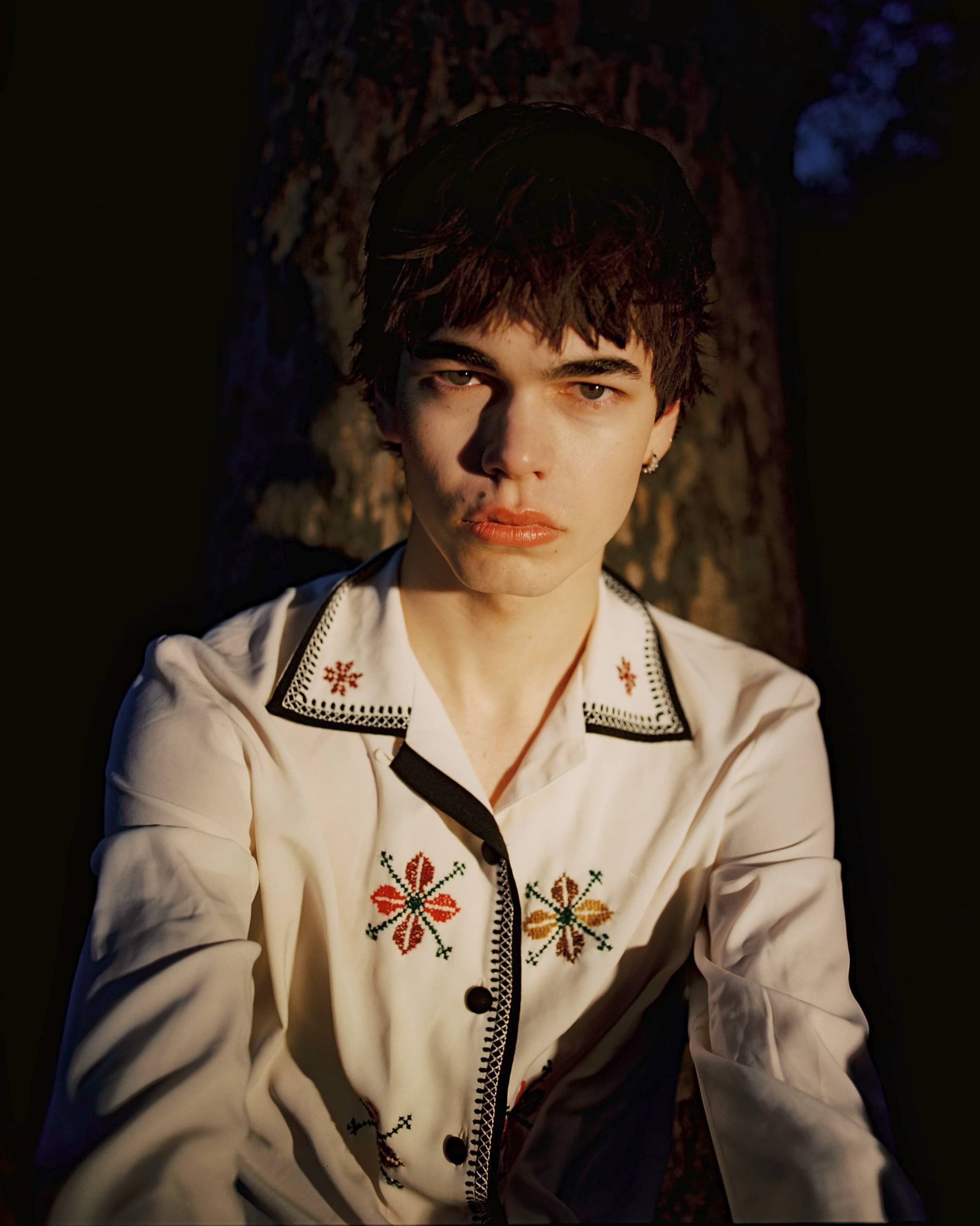 Man in white shirt with embroidery